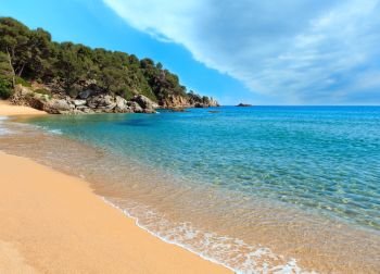 Mediterranean sea rocky coast summer view with sandy beach, Costa Brava, Catalonia, Spain.