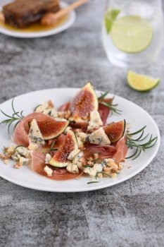 Figs with Parma ham with blue cheese, nuts and honey