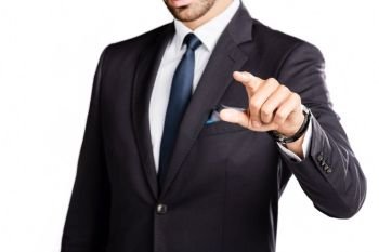 Businessman pointing his finger, wearing a suit and tie. Work and career concept.. Businessman pointing his finger.