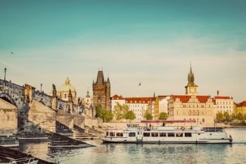Prague, Czech Republic skyline with historic Charles Bridge. Boat cruise on Vltava river. Vintage. Prague, Czech Republic. Charles Bridge, boat cruise on Vltava river. Vintage
