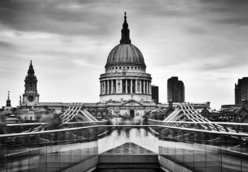 St Paul’s Cathedral dome seen from Millenium Bridge in London, the UK. Black and white. St Paul’s Cathedral dome seen from Millenium Bridge in London, the UK.