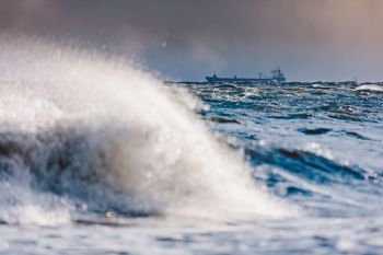 Stormy waves on the sea. Natural phenomenon. Baltic Sea in Gdynia, Poland.. Stormy waves on the sea.
