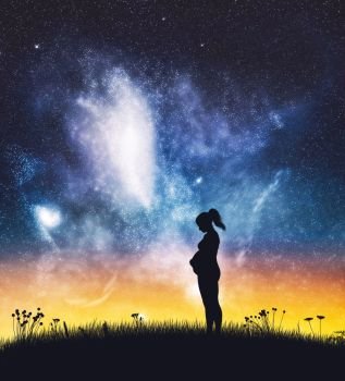 Pregnant woman standing on night sky. Silhouette on the field. Maternity, expecting a baby.. Pregnant woman standing on night sky.