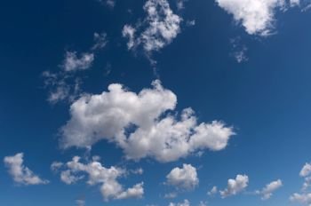 Beautiful white clouds with blue sky. Color shade gradient from white to blue for background wallpaper.