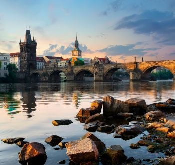 Charles Bridge and stones on river Vltava  in Prague at early morning
