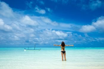 woman relax on the beach. Vacation at Paradise. Ocean beach relax, travel to Maldives islands
