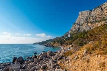 rocky shore of a picturesque sea bay in the autumn sunny afternoon. Black Sea, Crimea