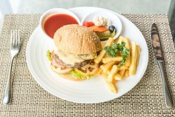 Beef hamburger with fires and fresh vegetable
