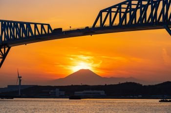 Diamond Fuji in Tokyo with Tokyo Gate Bridge, natural phenomenons that sun move pass mountain Fuji while sunset in Tokyo Japan. This happen only 2 times once a year.