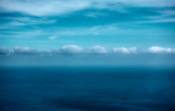 Sea and clouds - surreal seascape with spase for your own text. Filtered image                      