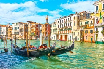 View of The Grand Canal in Venice with moored gondolas in the day time, Italy 