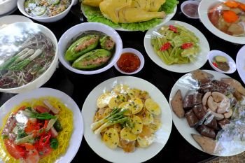 Variety of food on party table, group of Vietnamese food model imitation from Vietnam cuisine make by plastic, colorful of popular food with noodle, vegetables, soup, roll from high view
