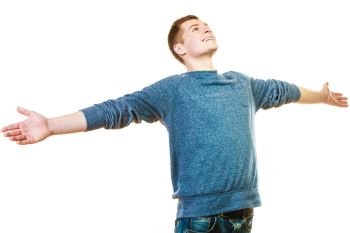 Success positive emotions, happiness freedom. Happy young man successful lad with arms raised looking upwards isolated on white background