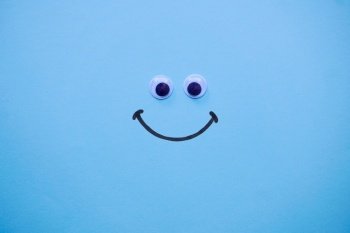 smile emotion on the blue background