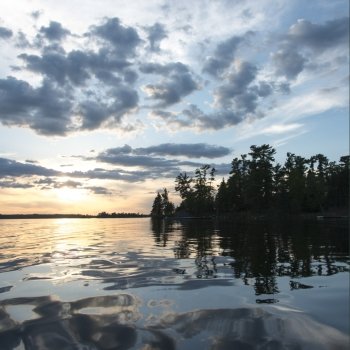 Reflection of tress and clouds on water, Lake of The Woods, Ontario, Canada