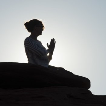 Woman in silhouette doing yoga, Green Gables, Cavendish, Prince Edward Island, Canada
