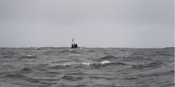 Fishermen in a boat on the Pacific Ocean, Skeena-Queen Charlotte Regional District, Haida Gwaii, Graham Island, British Columbia, Canada