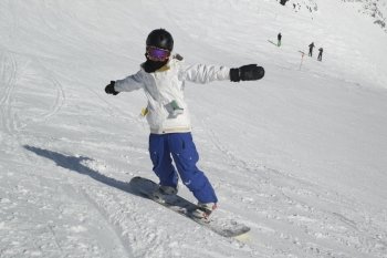 Girl snowboarding, Whistler, British Columbia, Canada