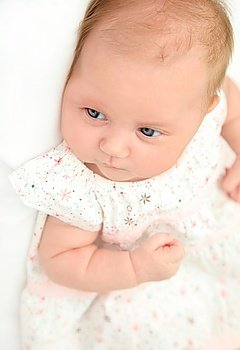 Little cute baby girl wearing a dress 
