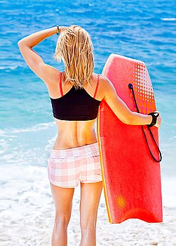 Girl surfer on the beach, beautiful sporty female holds bodyboard, fit sexy body woman do sport outdoor, summer fun fitness, water sport, teen healthy lifestyle concept