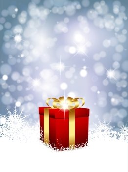 Christmas gift in snow on a blue glittery background