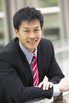 Portrait Of Chinese Businessman Outside Office