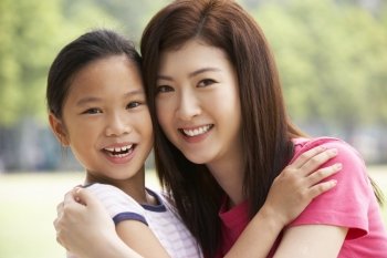Portrait Of Chinese Mother With Daughter In Park