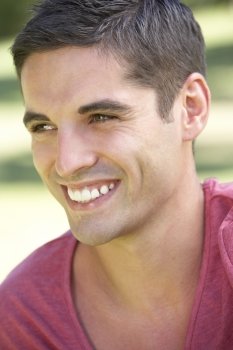 Outdoor Portrait Of Smiling Young Man