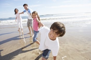 Family Having Fun On Beach Holiday