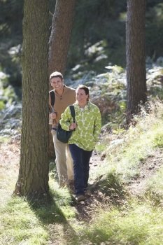 Couple On Country Walk Through Woodland