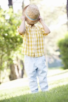 Young Boy Playing In Summer Garden
