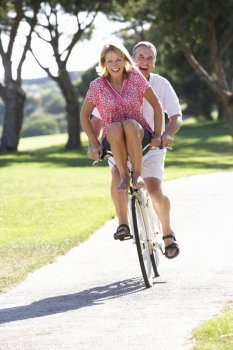 Senior Couple Enjoying Cycle Ride