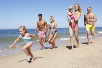 Multi Generation Family Enjoying Beach Holiday
