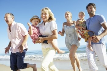 Multi Generation Family Enjoying Beach Holiday