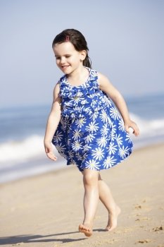Little Girl Running Along Beach