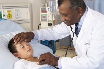 Doctor Examining Child Patient On Ward