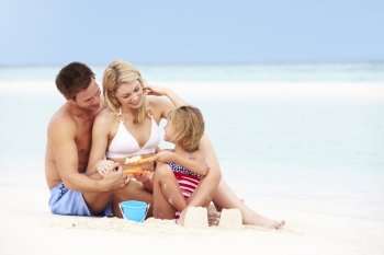 Family On Playing On Beautiful Beach