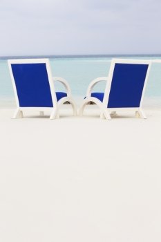 Empty Chairs On Beautiful Tropical Beach