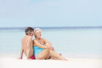 Senior Couple Relaxing On Beautiful Beach Together
