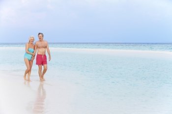 Senior Romantic Couple Walking In Beautiful Tropical Sea