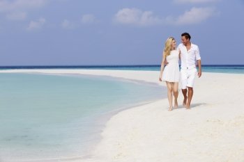 Romantic Couple Walking On Beautiful Tropical Beach