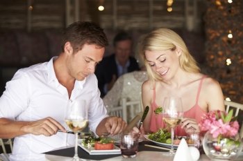 Couple Enjoying Meal In Restaurant