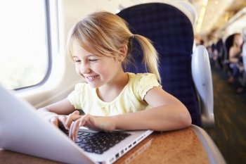 Girl Using Laptop On Train
