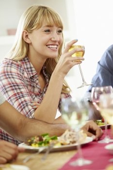 Young Woman Relaxing At Dinner Party