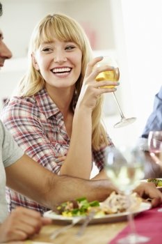 Young Woman Relaxing At Dinner Party