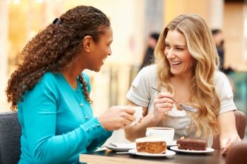 Two Female Friends Meeting In Cafe