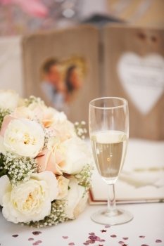 Bride's Bouquet And Glass Of Champagne On Wedding day