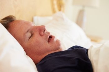 Overweight Man Asleep In Bed Snoring