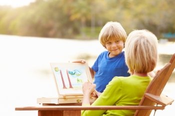 Grandmother With Grandson Outdoors Painting Landscape