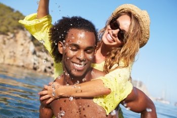 Romantic Young Couple Having Fun In Sea Together